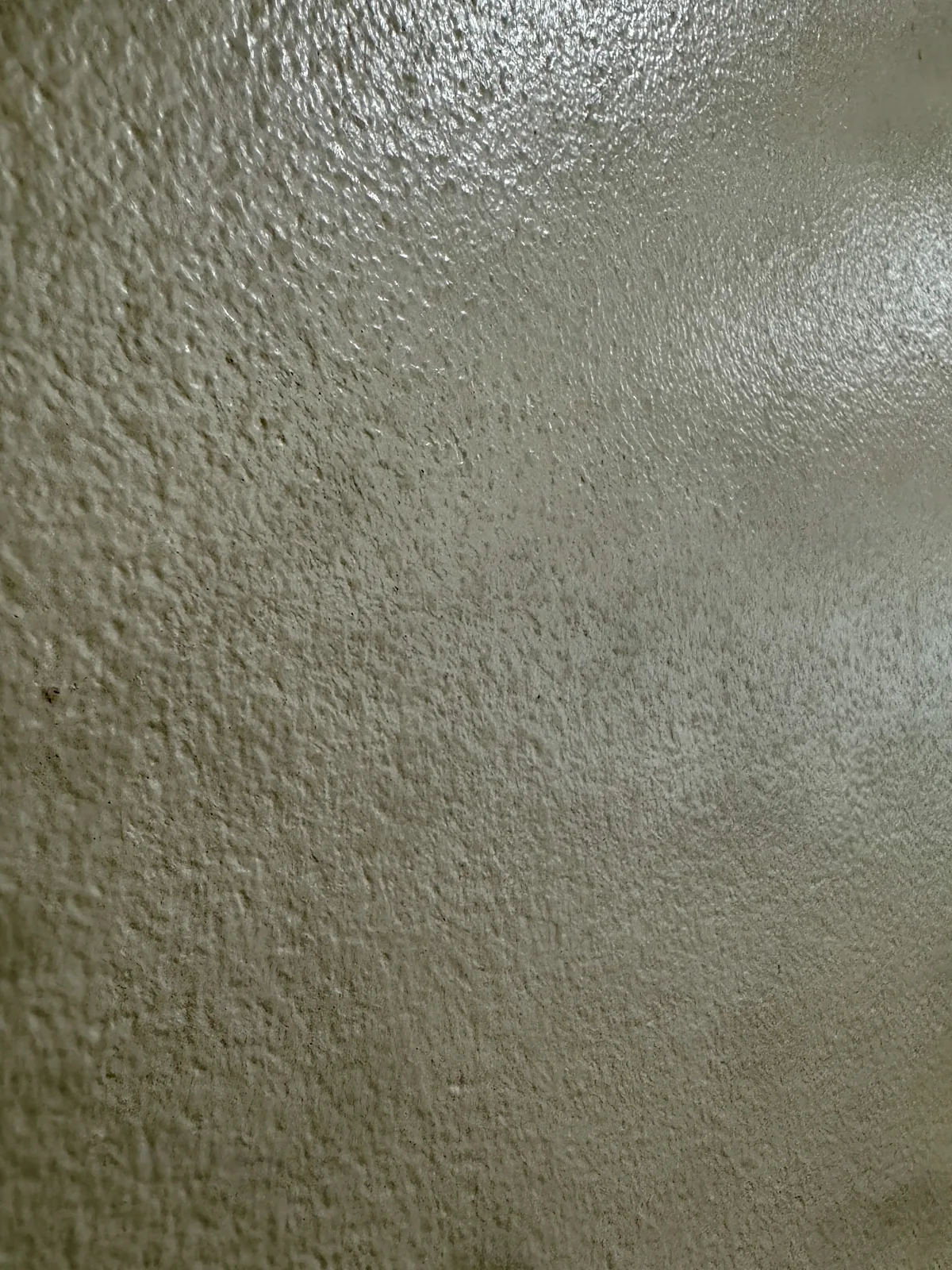 Close-up of heavily textured wall before skim coat